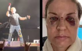 El vocalista de Guns N' Roses, Axl Rose, lanza micrófono al público y  golpea el rostro de una fan