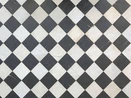 Textured white subway tiles on the walls add visual interest to the neutral space without taking attention away from the classic lines of the cabinetry. Floorscheckerboard0035 Free Background Texture Marble Floor Tiles Checker Checkerboard Black White