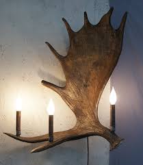 Moose Antler Wall Sconce 3 Lights Natural Antler Made In Usa Shop for moose decor, lamps, and moose gifts at black forest decor, including cabin accessories and other wildlife decor.