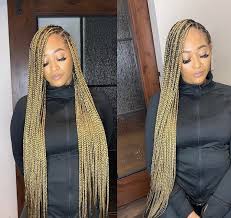 Brown Black And Blonde Knotless Box Braids Spring Into A New Look What Color Is Best For You Voice Of Hair In 2020 Braids Hairstyles Pictures Protective Style Braids Hair Inspiration Color Blonde
