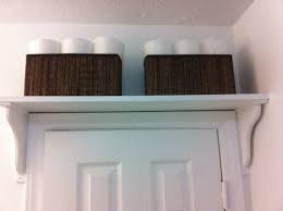 Shelf Above Bathroom Door For Extra Storage I Used Ikea Ekby Hensvik Brackets And Motorp Baskets Cheap And Easy Shelves Shelf Over Door Bathroom Doors