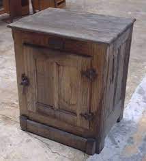 The cabinet has interesting and unique design. Cabinet Reproduction Antique Oak Ice Box Psw