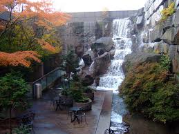 Tiny waterfall garden park, in seattle's pioneer square neighborhood, offers a peaceful respite from the surrounding streets, with tables, chairs, and benches that invite a relaxing visit. Waterfall Garden Park Seattle