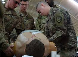 Spc. Mikeal Ellington, right, 300th Sustainment Brigade,