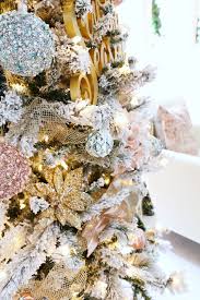 50+ unique christmas door decoration ideas. Flocked Christmas Tree With Pink And Gold Accents Classy Clutter