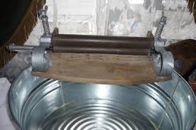 Make sure it's laying flat and in its original shape, then roll it like a sleeping bag in the towel to wring out excess water. Laundry Project Maybe You Guys Can Help