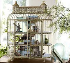 The brass bird cage has some dark spots on it, but the greenery and books are in great shape. Shelved Birdcage Bird Cage Decor Bird Cage Decor