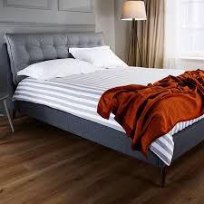 Opt for a platform bed and push it up against one or two shelves that you've already lined with books. Abitare Uk Whitemeadow Dexter Bed Frame