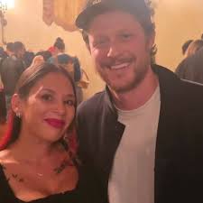 Noah holding arm of fan