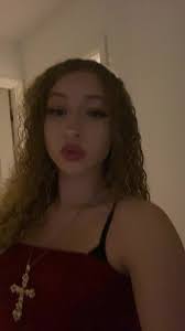 Girl in Viral Video with White Blue Dress and Reading Phone in Bed