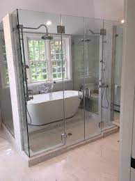 Double Overhead Shower Heads Glass Shower With Stone Work Over The Piping Path Creative Design Overhead Shower Head Glass Shower Shower Heads