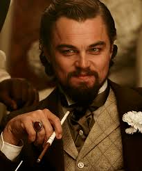 Gentlemen You Had My Curiosity But Now You Have My Attention Leonardo Dicaprio As Calvin Candie In Django Unchained Cena De Filme Tarantino Filmes