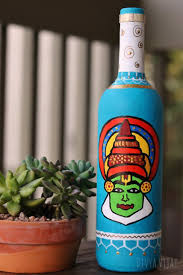 Repurpose Used Bottles And Give Them An Eccentric Makeover Kathakali Face Painted On An Used Bottle Upcyc Bottle Art Hand Painted Bottles Glass Bottle Diy