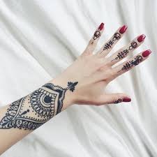This red and black henna tattoo paints a trail from the wrist towards the index finger. 175 Beautiful Henna Tattoo Ideas For Girls To Try At Least Once