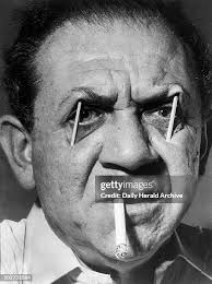 Sid James with matchsticks in his eyes, whilst smoking a cigarette,... News  Photo