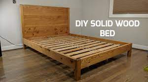 A log bed is a bed frame built entirely from logs that are cut and shaped to fit together without nails or screws. Diy Solid Wood Bed Nathan Builds Youtube