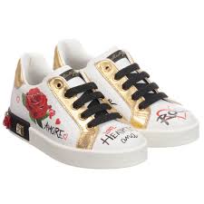 Girls White Leather Portofino Sneakers From Dolce Gabbana They Have A Graffiti Style Lettering Gold Tr Kid Shoes Little Girl Shoes Dolce And Gabbana Kids