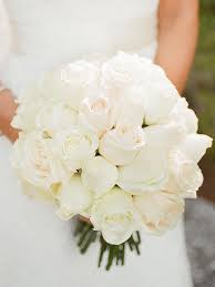 A classic winter wedding color theme is to go with a red, white & green scheme and we love the way it looks in these bouquets. It Doesn T Get Any More Elegant Than A Classic All White Rose Wedding Bouquet Weddingb White Rose Wedding Bouquet Rose Wedding Bouquet Flower Bouquet Wedding