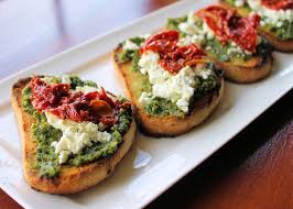 The walnuts add a festive touch. Goat Cheese Basil Pesto And Roasted Tomatoes Crostinis Enrilemoine