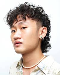The traditional mullet is defined by long hair all over with a longer style in the back. The The Permed Mullet Is Back Better Than Ever Is Back For 2021