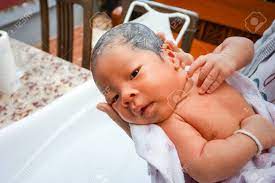 Use one of my diy no sew bamboo wipes or another natural baby washcloth you can find in that post or here. First Bathing Of A Newborn Baby Boy In A Bathtub Stock Photo Picture And Royalty Free Image Image 66364773