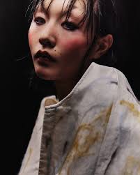 Ash Chen @ashtrayy_chen wearing dress and jacket by Luyi Yang. MS2 RAIN  This collection is inspired by rain-blurred glass, the earthy scent of  soil, and the cold touch of rain. It combines