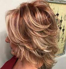 Elegant curly medium length haircut for women over 50: 80 Best Hairstyles For Women Over 50 To Look Younger In 2021