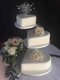 Maybe you would like to learn more about one of these? Heart Shaped Wedding Cakes On Three Tier Cake Stand Decorated With Fresh Flowers H Wedding Cake Fresh Flowers Heart Shaped Wedding Cakes Wedding Cake Stands