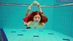 Hot Polish redhead swimming in the pool