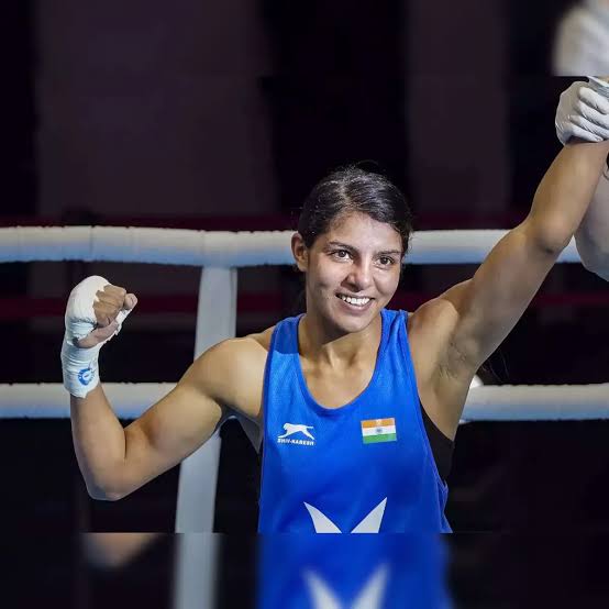 Sakshi Chaudhary celebrating in the ring after her gold medal match, AI generated