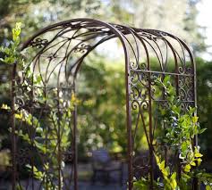 This arbor is complete with a matching gate for added privacy as well as a ground base for stability. Garden Trellis Screening Garden Fence Panels Gates Iron Trellis Arch