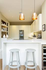 A galley kitchen has two parallel walls of cabinetry with a walkway in. Small Galley Kitchen Ideas Love Renovate