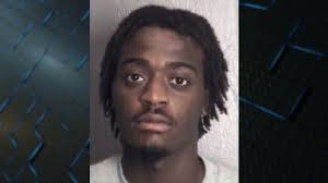 Murder suspect accused of assaulting officer at detention center