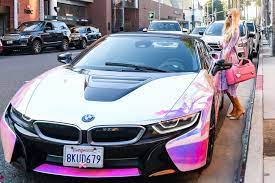 Paris Hilton Was Snapped In La Wearing A Sparkly Lavender Outfit That Perfectly Matched Her 165000 Customized Holographic Bmw I8 Roads Bmw Bmw I8 Pretty Cars