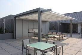 This Is Not Your Ordinary Retractable Awning It Is A Retractable Water Proof Not Water Resistant Patio Cover System Pergola Pergola Patio Rooftop Design