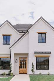 This stucco exterior has a brick red color with black trim as the combination. Our Three Inside Tips For Shopping Home And Garden On Ebaybecki Owens Brick Exterior House White Exterior Houses Painted Brick Exteriors