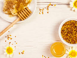 top view of honeycomb honey and bee pollen with white