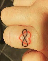 60 Romantic Ring Finger Tattoo Ideas In 2021 Wedding Band Tattoo Ring Finger Tattoo Ring Tattoo Designs