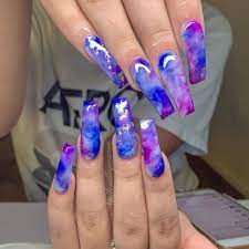 On the accent nails, load up on glitter and rhinestones in the same mother of pearl shade for a rainbow effect within some serious sparkle. Pin By Ann Katrin On Nails Coffin Nails Designs Purple Nails Blue Nails