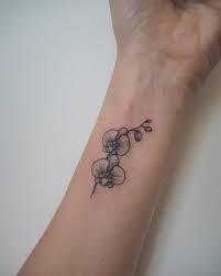 People not only decorate their dwellings with flowers but also love to grace their body parts with flower tattoos. Orchid Done By Dr Kate Tattoo Whitewhaleamsterdam Tattooart Organictattoo Flowertattoo Linetattoo Blacktattoo Small Tattoos Simple Tattoos Tattoos
