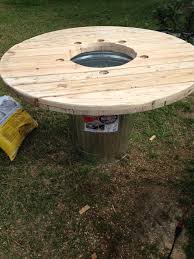With Just A Few Modifications A Metal Trash Can And One Side Of A Wooden Cable Spool Makes For One Serious Crawfis Spool Tables Diy Cable Spool Table Crawfish