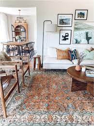 Here, a vintage area rug is a cozy backdrop for plants, and woven or wicker baskets and furniture. Nov 29 2019 This Pin Was Discovered By Lizavanechka Discover And Save Your Own Pins On Pinterest Rugs In Living Room Farm House Living Room Home