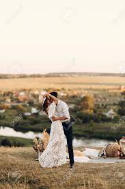 Check spelling or type a new query. Beautiful Wedding Couple In Nature In Boho Style Wedding In The European Style Of Fineart At Sunset Stock Photo Picture And Royalty Free Image Image 151420907
