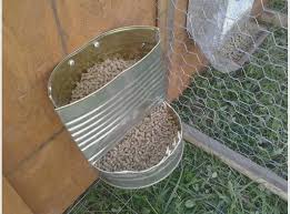 The boxes have concrete floors, half doors and electric lighting. Diy Indoor Rabbit Housing Google Search Rabbit Feeder Meat Rabbits Rabbit Cages