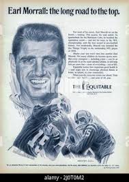 Quarterback Earl Morrall of the Baltimore Colts, who still has a somewhat  outmoded crew cut hairdo, laughs as he views the pink jump suit and handbag  worn by teammate Roy Jefferson, Dec.