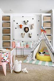 Copy this playroom idea and combine open and closed shelving to display decorative toys and books and hide away anything that isn't quite as pretty. 6 Adult Friendly Decor Ideas For Kids Spaces Kids Playroom Ideas
