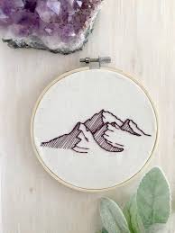 Large hoop with the 50's fashion dress is 9 and the smaller hoop with the pink poodle. Mountain Embroidery Hoop Wall Art Boho Decor Embroidery Hoop Art Minimalist De Embroidery Hoop Wall Art Embroidery Hoop Wall Embroidery Stitches Tutorial