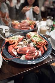 The traditional clambake—building a fire, heating stones, laying in seaweed, layering shellfish with potatoes, sausages, and corn, and topping the whole thing with more seaweed to let it bake—is a great new england tradition but a heck of a lot of work. Clambake Wikipedia