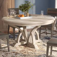 Round dining table set with four chairs, each with a neutral black finish, tampered curved legs, and open wooden slat backrests. 42 Beautiful Photos Of Design Decisions 60 Inch Round Dining Room Tables Wtsenates Info