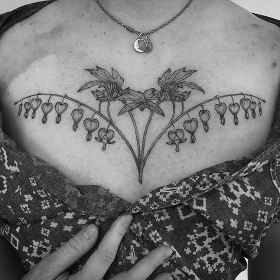 Wildflower chest tattoo | Bouquet chest tattoo, Botanical chest tattoo female, Chesttattoo